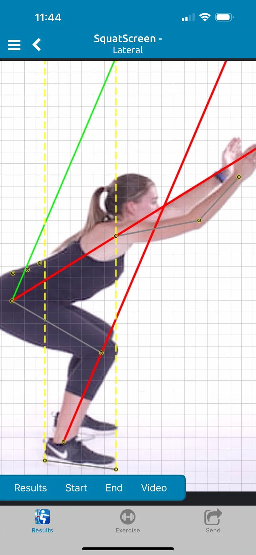 SquatScreen lateral overhead squat on iPhone for the demo client: the end position on a grid, with landmark points, yellow vertical reference lines, and green and red lines along the torso and shins.